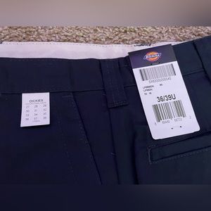 4 pairs of Dickies navy blue men’s utility pants. New with tags.